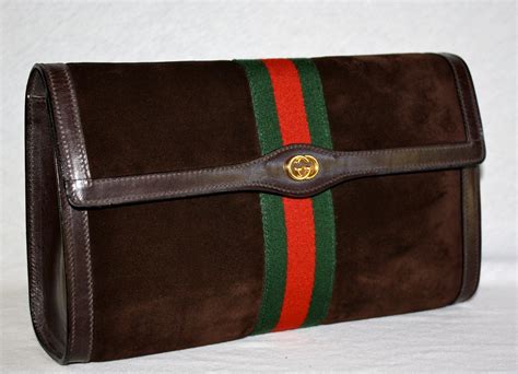 vintage gucci clutch metal handle|gucci vintage suede clutch.